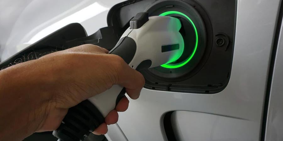 Close-up of electric vehicle charging